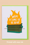 Card with flames and text 'What a time to be alive' on a beige background