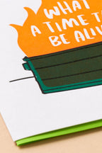Book with a green bookmark and an orange section with text on a white background