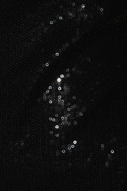 close up of black sequin dress