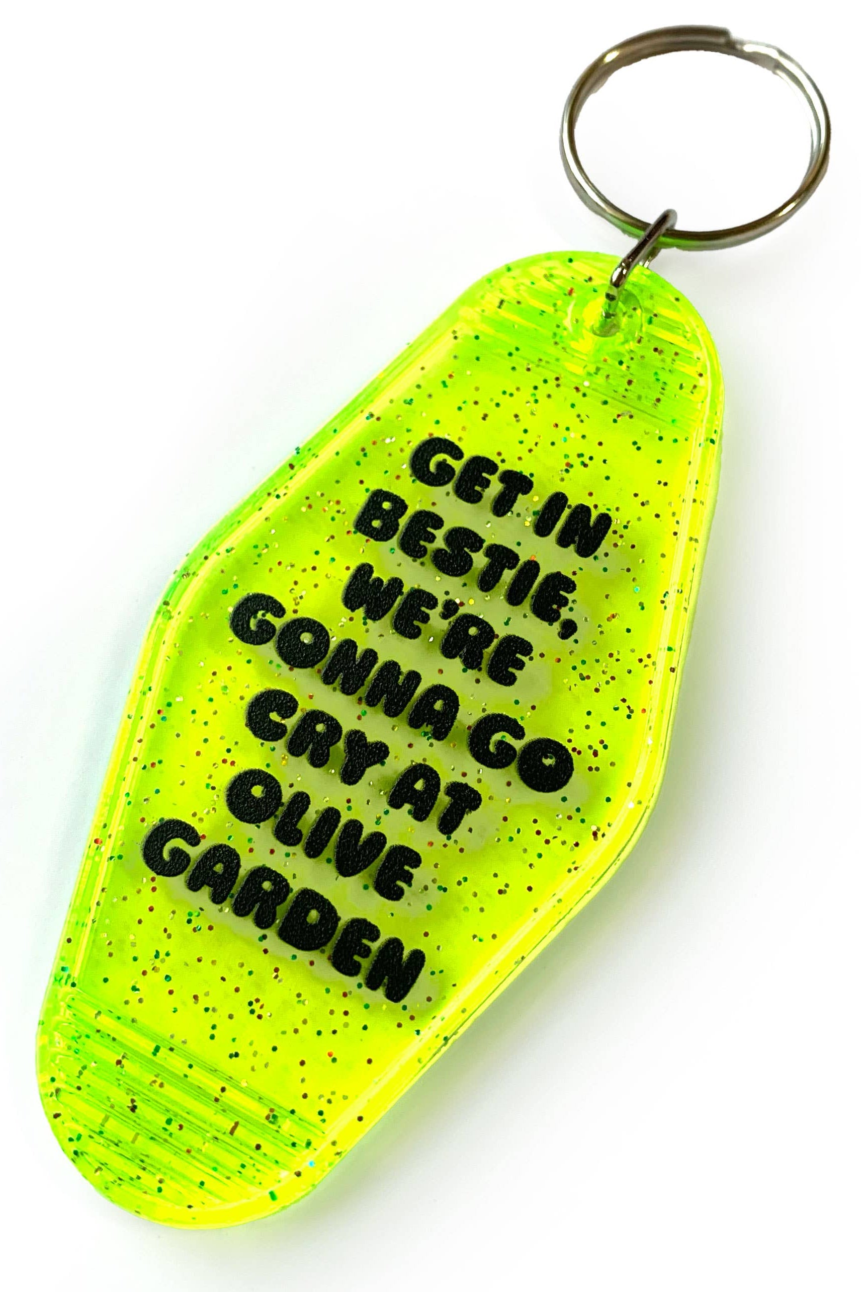 Yellow keychain with black text on a white background