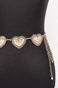 Gold heart-shaped belt on a black mannequin