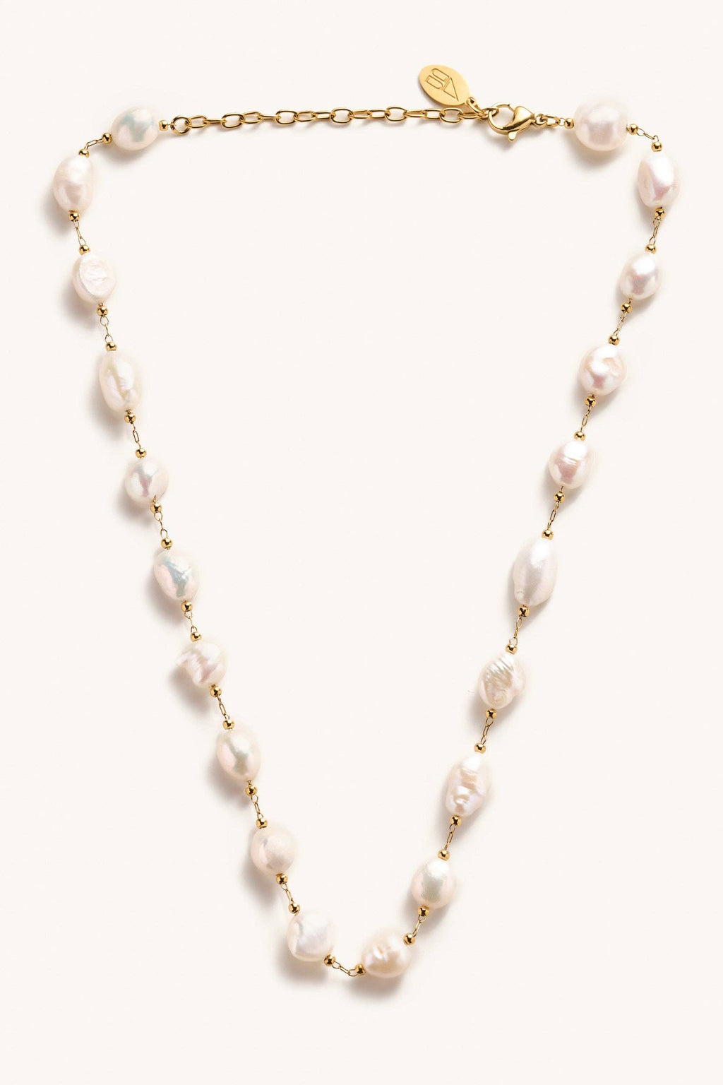 Pearl necklace with gold chain on a white background