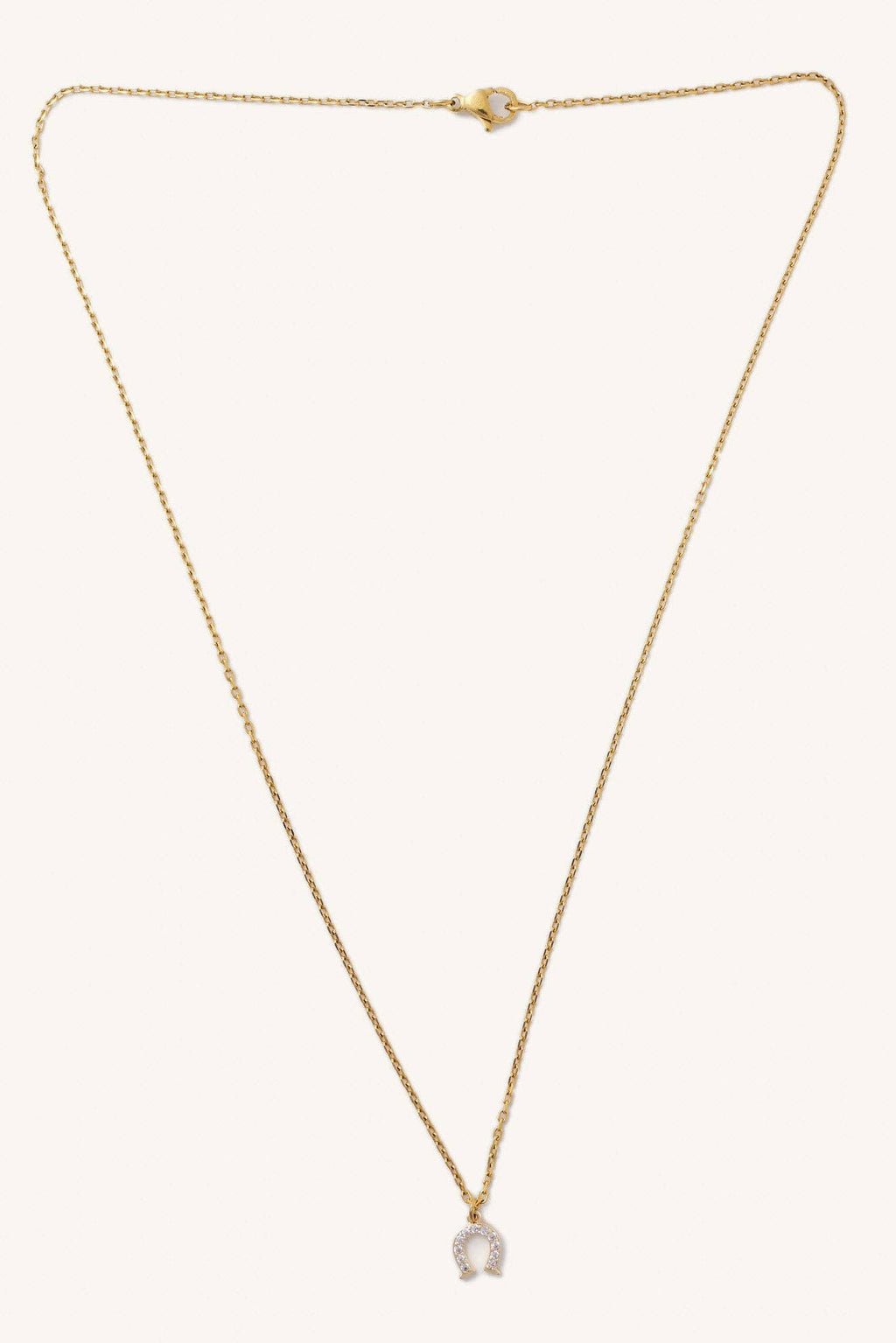 Gold necklace with a small pendant on a white background