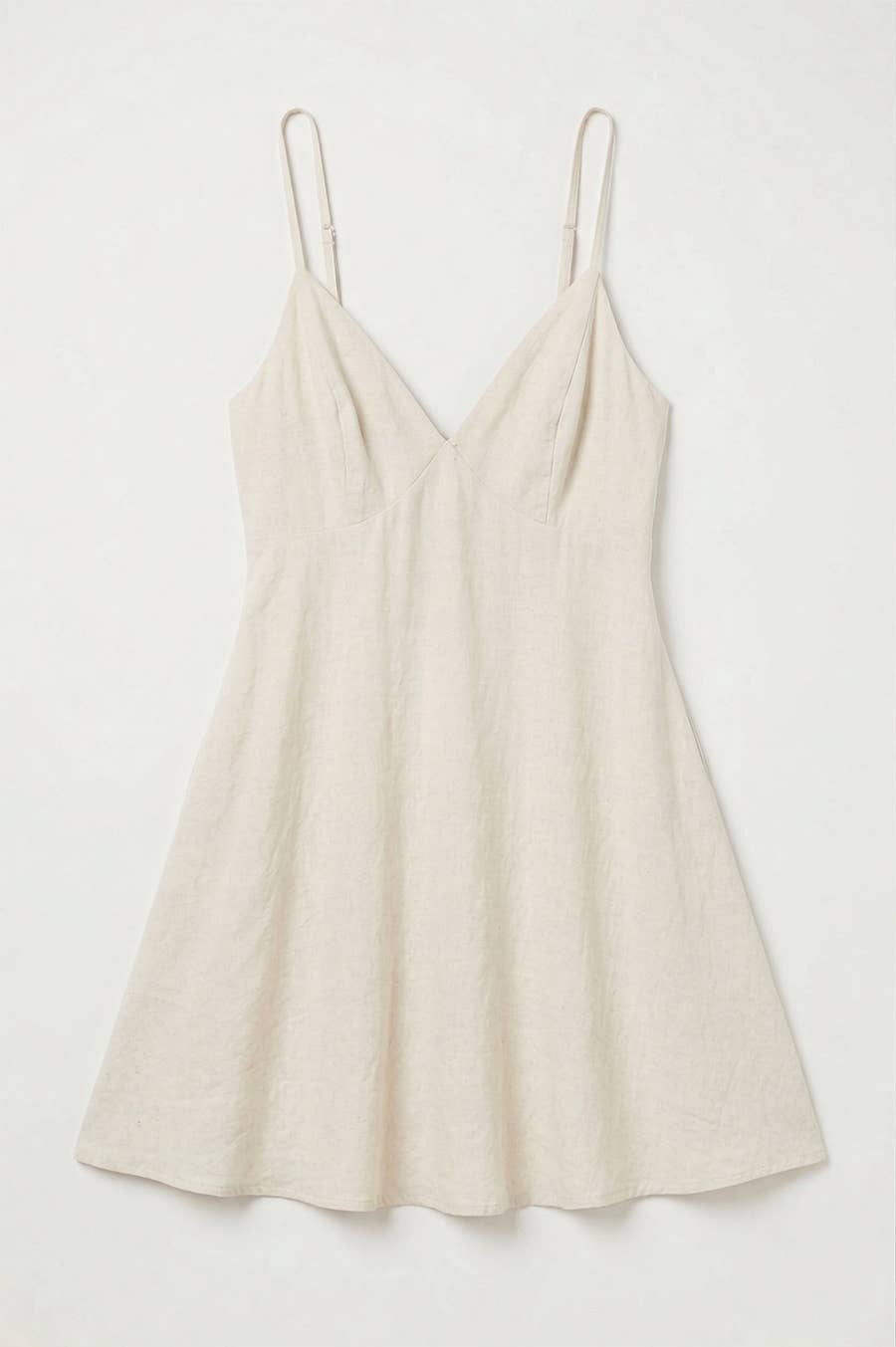 Beige slip dress on a white background