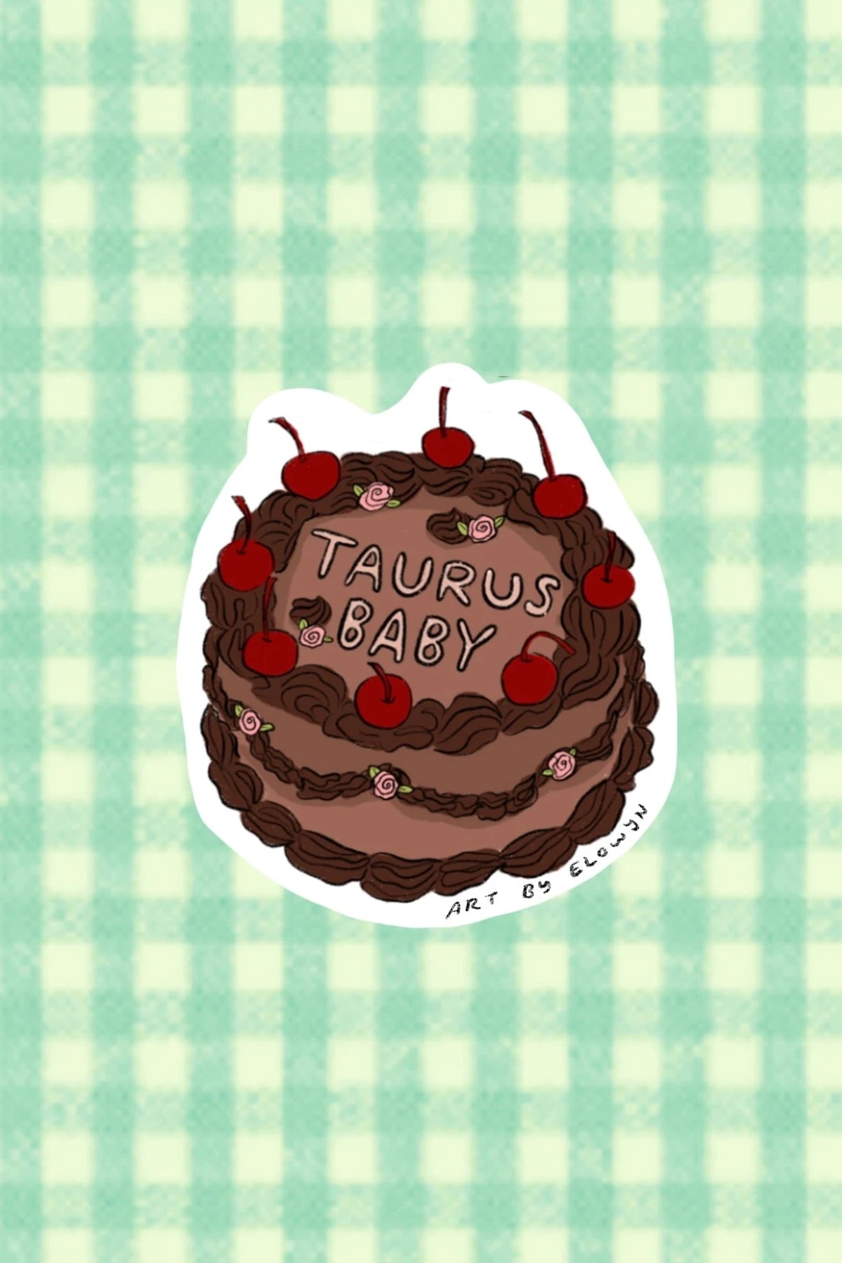 Sticker of a chocolate cake with cherries and 'Taurus Baby' text on a green checkered background