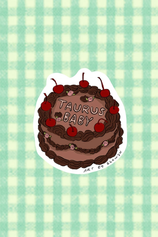 Sticker of a chocolate cake with cherries and 'Taurus Baby' text on a green checkered background